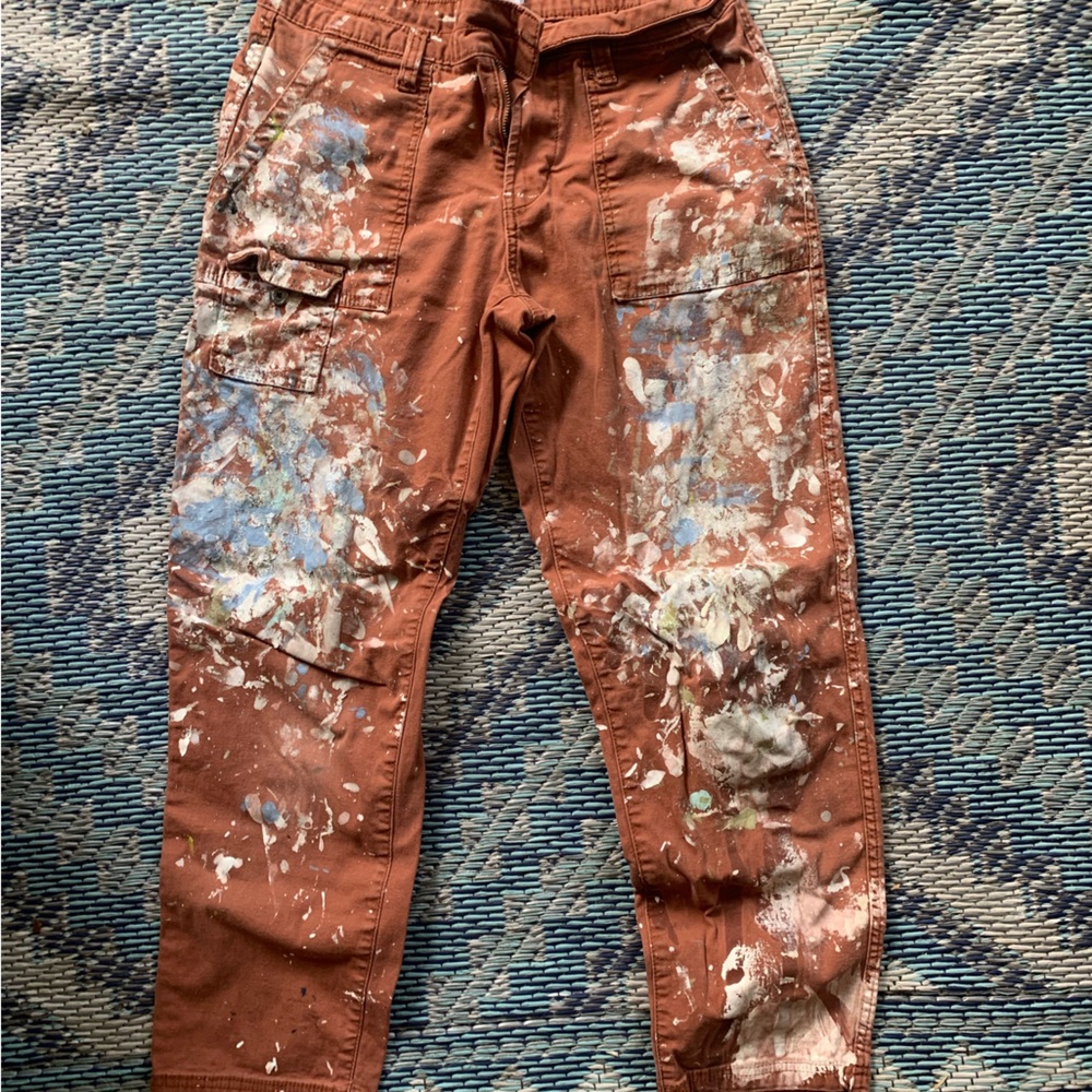Women’s paint splatter paints in warm brown